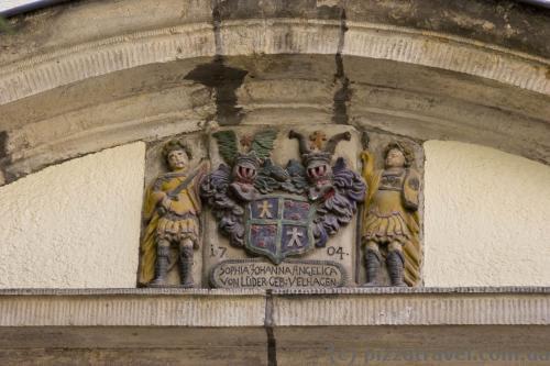 Coats of arms remained on many houses.